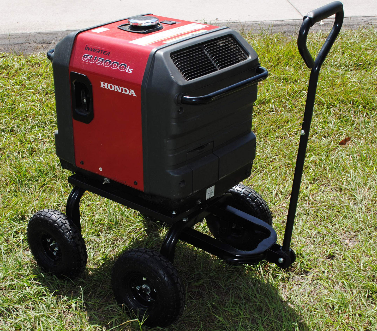 Honda generator on wheels in a grassy area